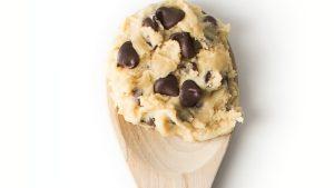 Chocolate chip cookie dough on a wooden spoon