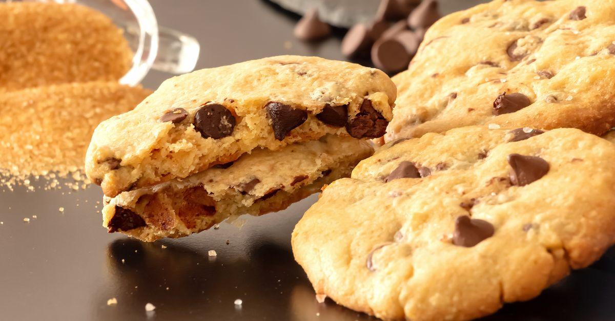 Homemade salted caramel chocolate chips cookies. Dark background.