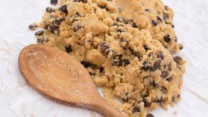 Wooden spoon with chocolate chip cookie dough
